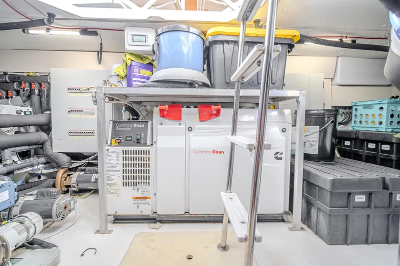 Slide: The Image of Engine room of 2019 Azimut 66 yacht with Cummins Onan generator and storage bins. - 94