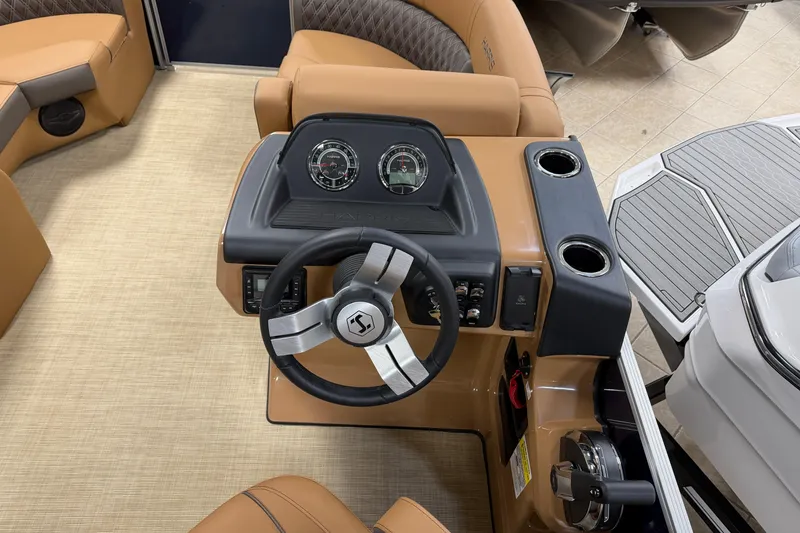 Slide: The Image of 2026 Harris Cruiser 190 boat dashboard with steering wheel and gauges. - 5