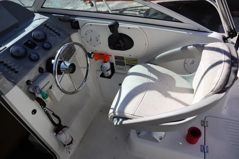 Slide: The Image of 2008 Trophy 2102 Walkaround boat cockpit with steering wheel and captain's chair. - 3