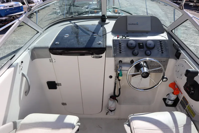 Slide: The Image of 2008 Trophy 2102 Walkaround boat cockpit with steering wheel and Garmin navigation system. - 4