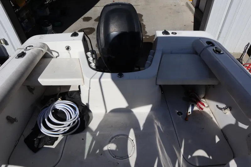 Slide: The Image of 2008 Trophy 2102 Walkaround boat interior with engine and storage compartments. - 8