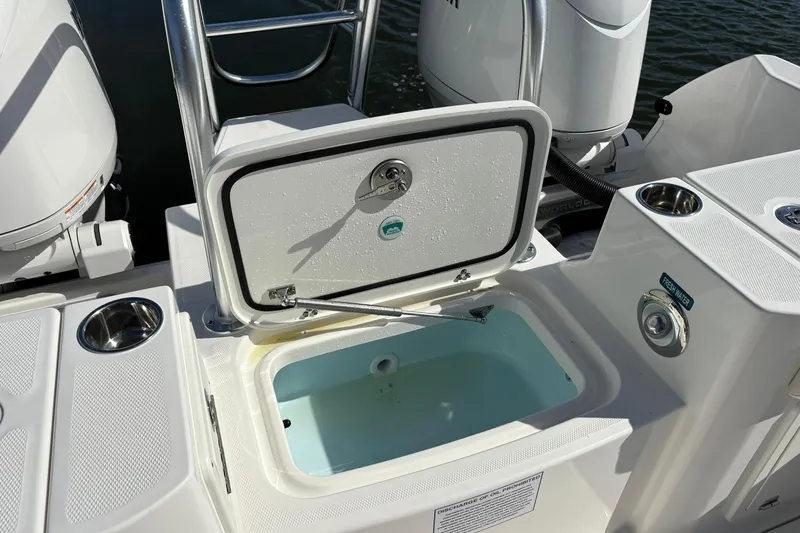 Slide: The Image of Livewell on 2026 World Cat 235 TE boat, open lid, freshwater access. - 11