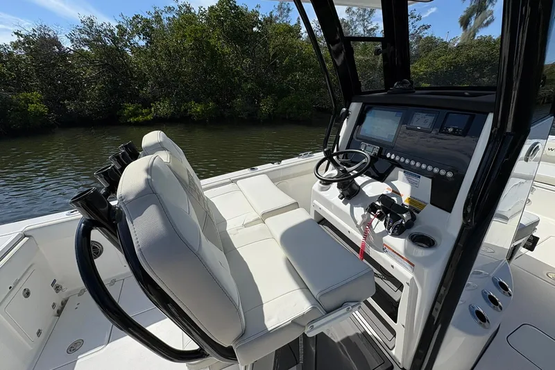 Slide: The Image of 2026 World Cat 235 TE boat interior with modern helm and seating. - 25