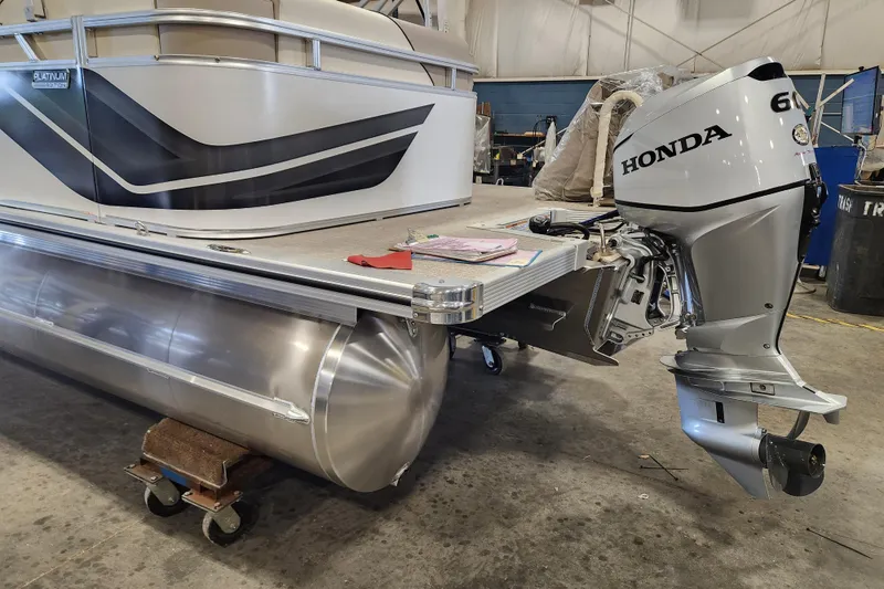 Slide: The Image of 2026 Avalon VENTURE CRUISE pontoon boat with Honda 60 outboard motor in a workshop. - 10