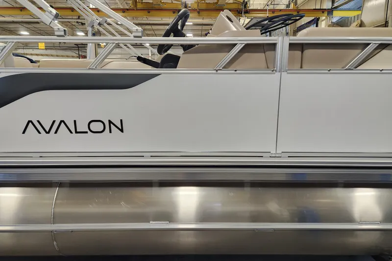 Slide: The Image of 2026 Avalon VENTURE CRUISE pontoon boat side view in a showroom. - 12