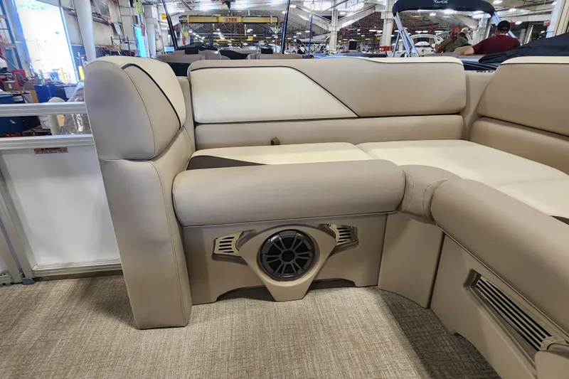 Slide: The Image of 2026 Avalon VENTURE CRUISE boat interior with beige seating and built-in speaker. - 17