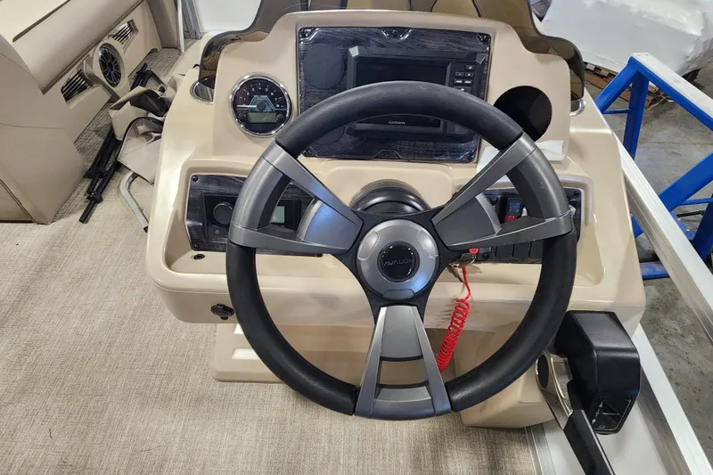 Slide: The Image of 2026 Avalon VENTURE CRUISE boat dashboard with steering wheel and control panel. - 18