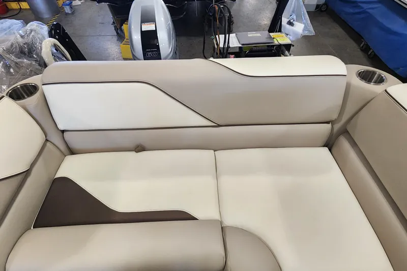 Slide: The Image of 2026 Avalon VENTURE CRUISE boat seating with beige upholstery and cup holders. - 19