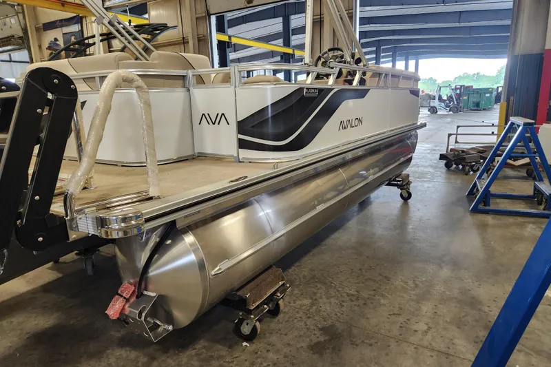 Slide: The Image of 2026 Avalon VENTURE CRUISE pontoon boat in a workshop setting. - 8
