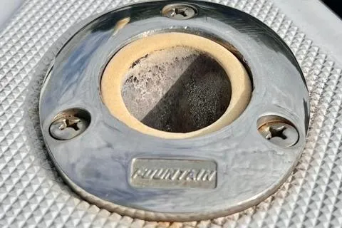 Slide: The Image of Close-up of a 1993 Fountain 27 Center Console boat fitting. - 108