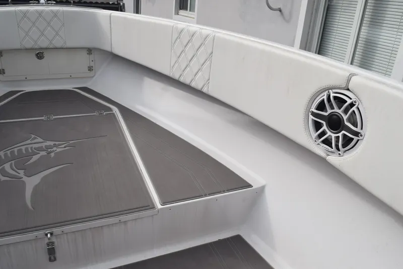 Slide: The Image of 1993 Fountain 27 Center Console boat interior with speaker and marlin design. - 16