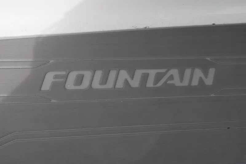 Slide: The Image of Fountain 27 Center Console 1993 logo on a gray surface. - 54