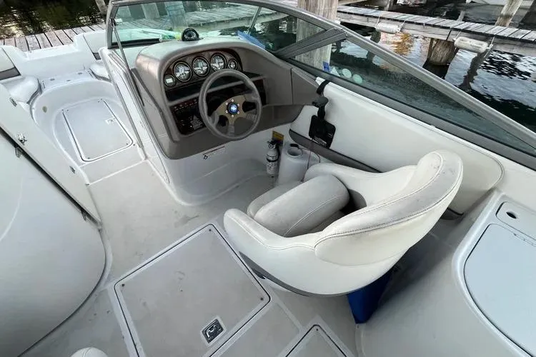 Slide: The Image of 2002 Four Winns 264 Funship boat interior with steering wheel and dashboard. - 15