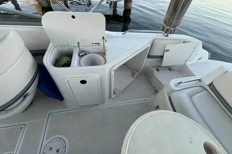 Slide: The Image of 2002 Four Winns 264 Funship boat interior with sink and seating area. - 19