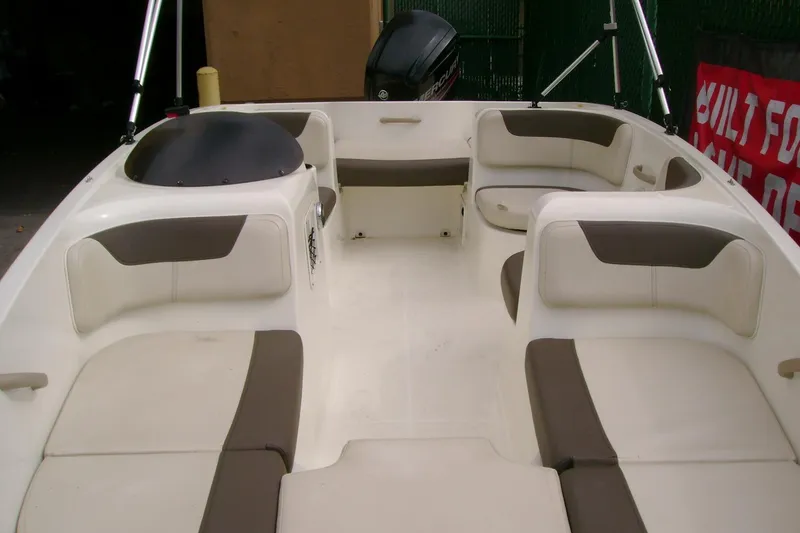 Slide: The Image of 2019 Bayliner Element E16 boat interior with spacious seating and modern design. - 2