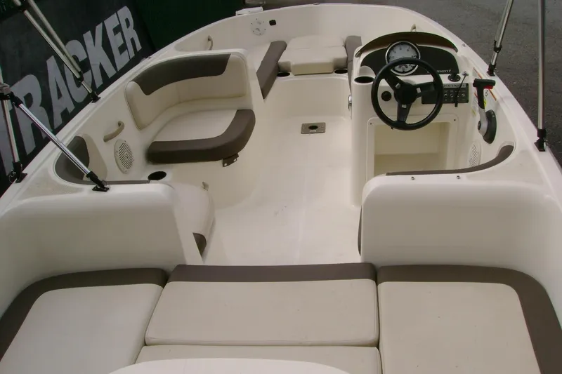 Slide: The Image of 2019 Bayliner Element E16 boat interior with seating and steering console. - 3