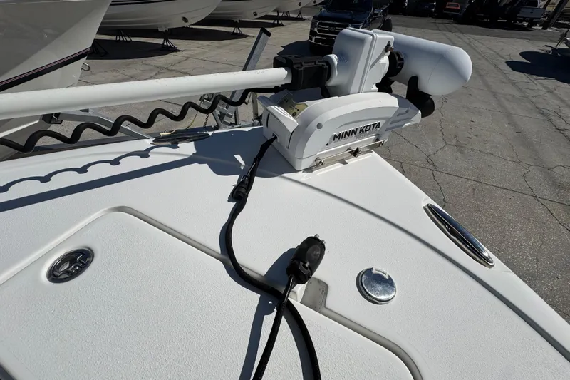 Slide: The Image of 2023 Sea Hunt Ultra 229 boat with Minn Kota trolling motor on deck. - 19