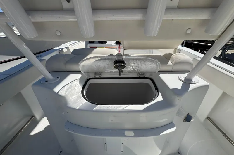 Slide: The Image of 2023 Sea Hunt Ultra 229 boat interior with open storage compartment. - 8
