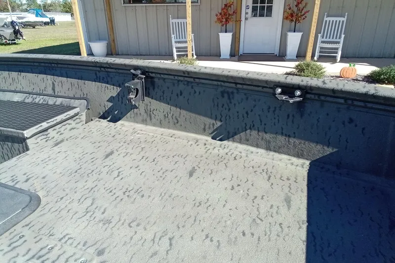 Slide: The Image of Interior view of a 2020 War Eagle 750 Gladiator boat with textured flooring. - 10