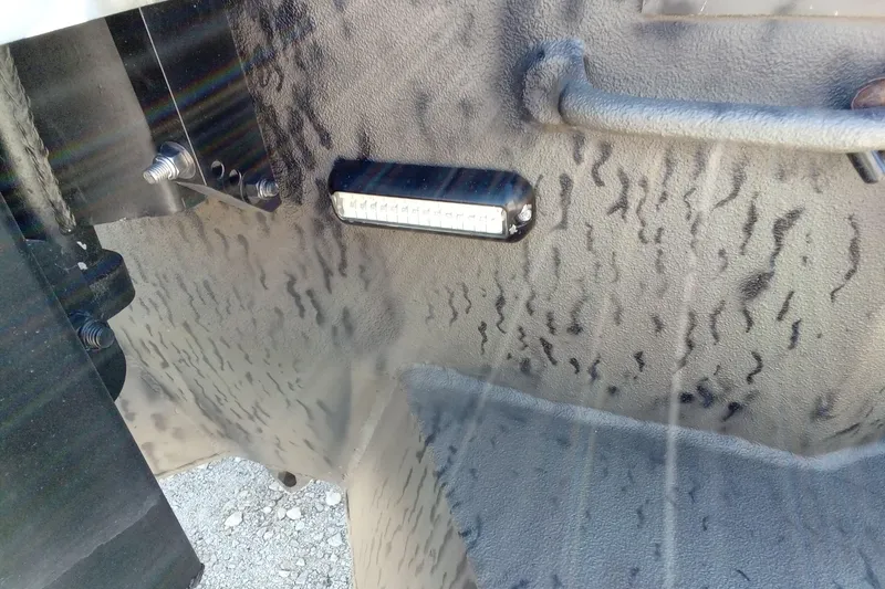 Slide: The Image of Close-up of War Eagle 750 Gladiator 2020 boat interior with textured surface and mounted light. - 15