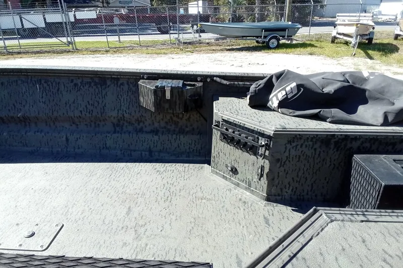 Slide: The Image of Interior of a 2020 War Eagle 750 Gladiator boat with storage compartments. - 22