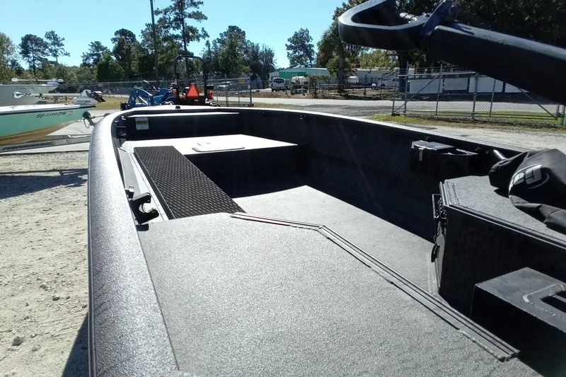 Slide: The Image of 2020 War Eagle 750 Gladiator boat interior, parked outdoors on a sunny day. - 25