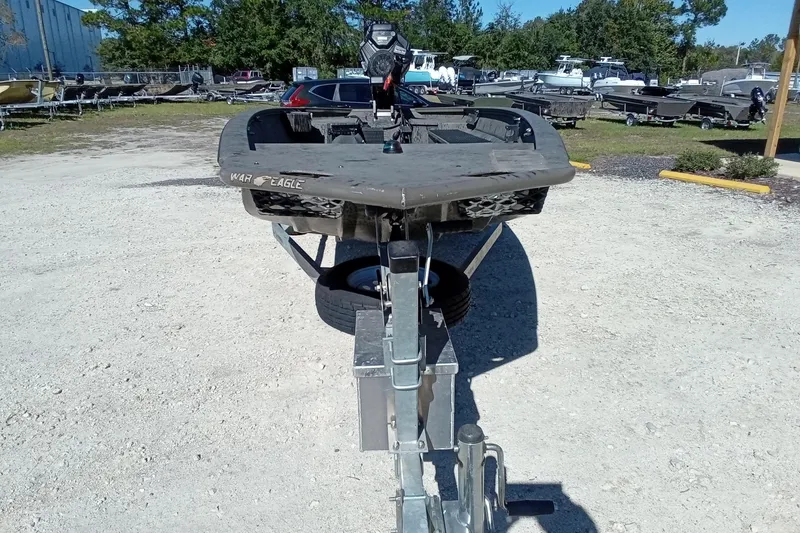 Slide: The Image of 2020 War Eagle 750 Gladiator boat on trailer in outdoor lot. - 6