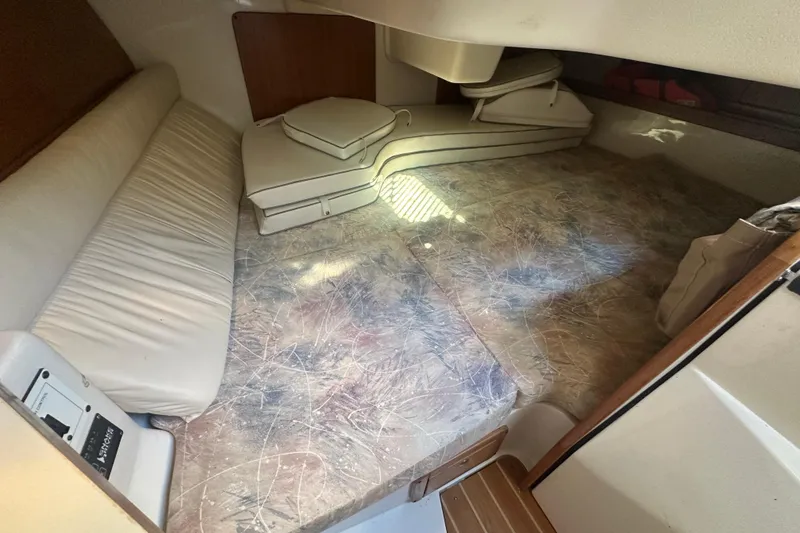 Slide: The Image of Interior cabin of a 2005 Catalina 310 sailboat with cushions and seating. - 28