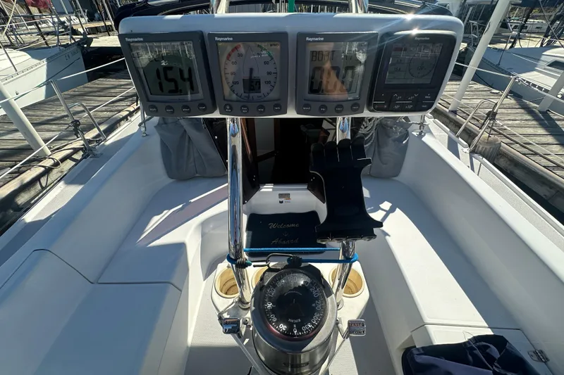 Slide: The Image of Cockpit of 2005 Catalina 310 sailboat with navigation instruments and compass. - 4