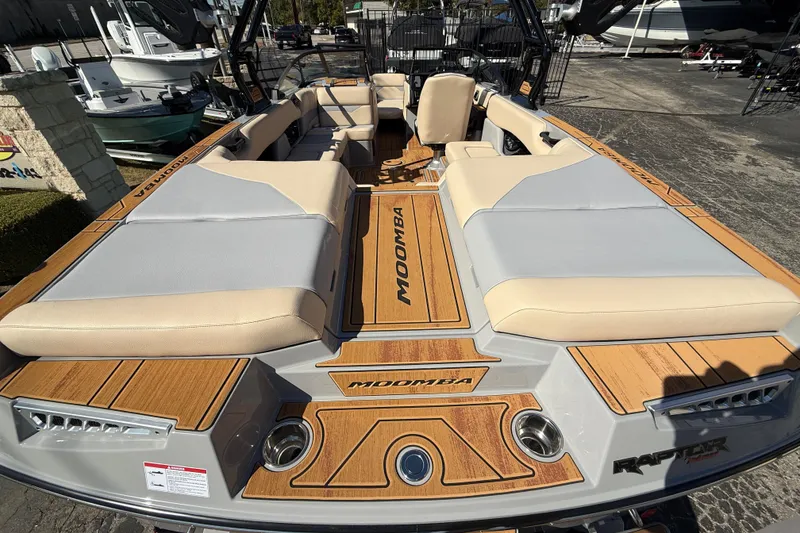 Slide: The Image of 2026 Moomba Mojo boat with spacious seating and stylish wood accents. - 11