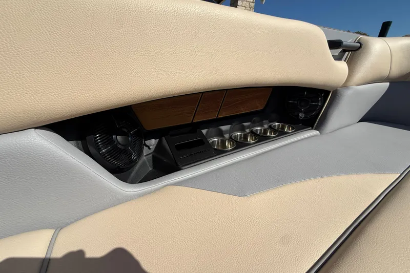Slide: The Image of 2026 Moomba Mojo interior with beige leather seats and built-in cup holders. - 21