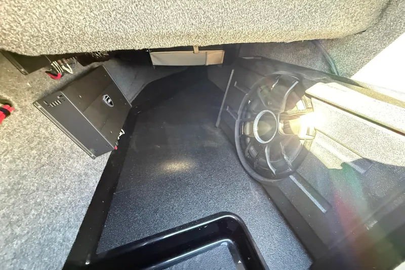 Slide: The Image of Interior view of 2026 Moomba Mojo boat storage compartment with speaker and amplifier. - 26