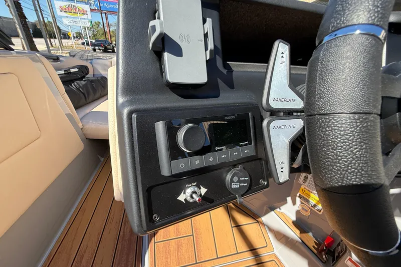 Slide: The Image of 2026 Moomba Mojo boat dashboard with controls and audio system. - 32