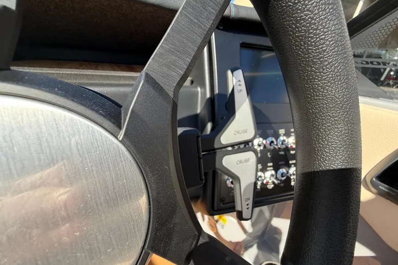 Slide: The Image of Steering wheel and controls of 2026 Moomba Mojo boat. - 34
