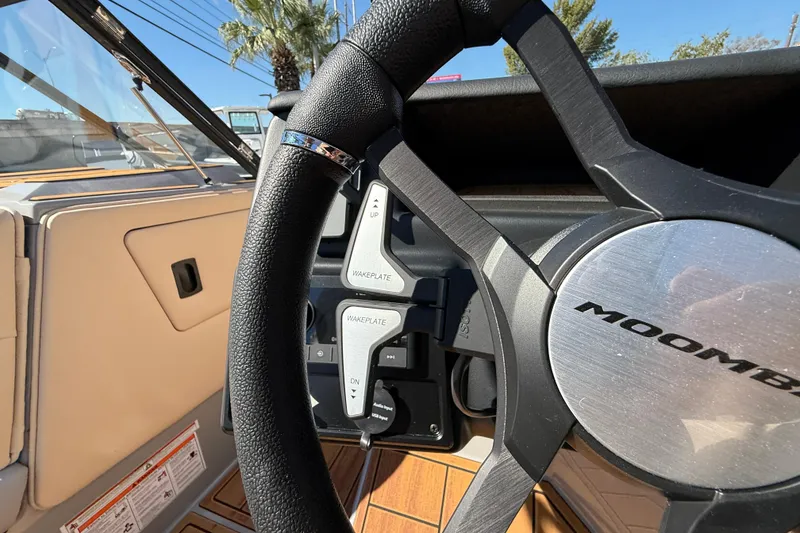 Slide: The Image of 2026 Moomba Mojo steering wheel with wakeplate controls, featuring sleek design and functionality. - 35