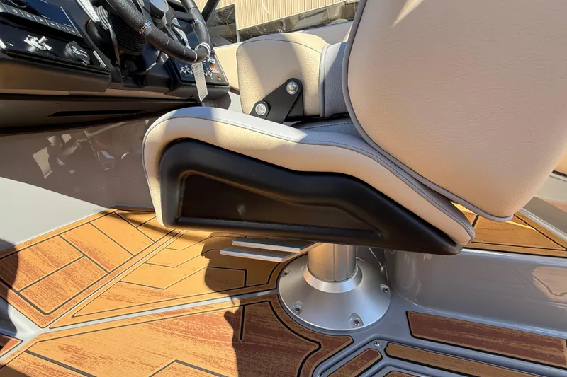 Slide: The Image of 2026 Moomba Mojo boat interior with sleek captain's chair and stylish wood-patterned flooring. - 37