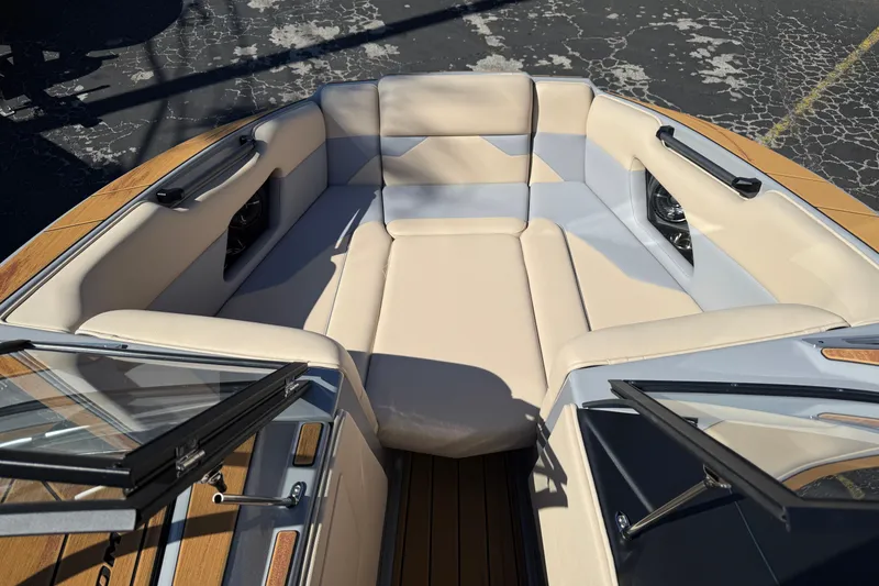 Slide: The Image of 2026 Moomba Mojo boat interior with beige seating and open windshield. - 41
