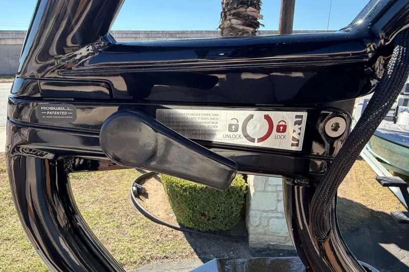 Slide: The Image of 2026 Moomba Mojo boat lock mechanism with Roswell patented design, featuring unlock and lock indicators. - 43