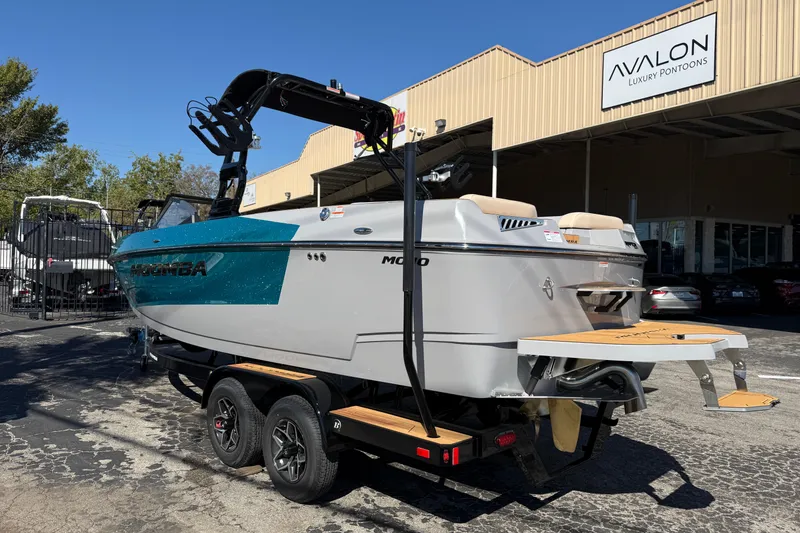 Slide: The Image of 2026 Moomba Mojo boat on trailer at Avalon Luxury Pontoons dealership. - 9