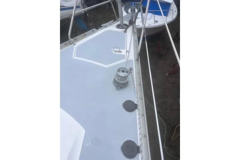 Slide: The Image of Deck of 1996 Hunter 37.5 Legend sailboat with winch and railing. - 18