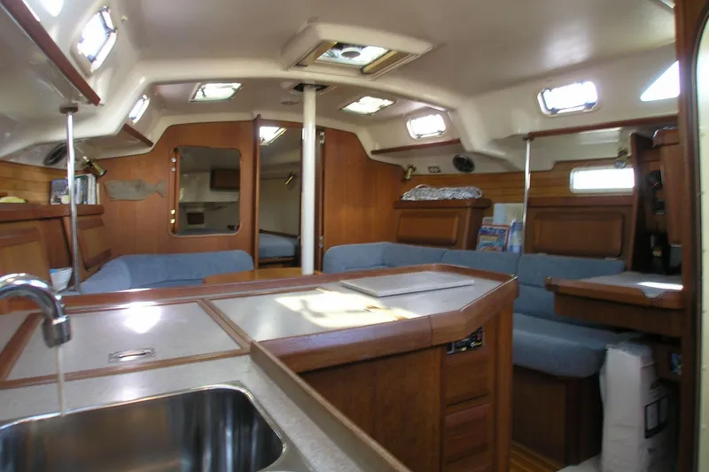 Slide: The Image of Interior of 1996 Hunter 37.5 Legend sailboat with cozy seating and wooden finishes. - 2