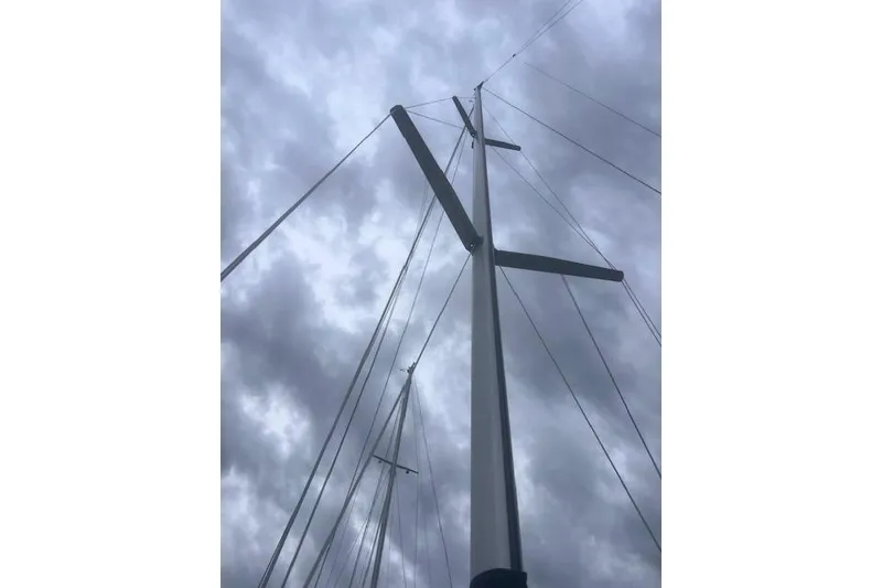 Slide: The Image of Mast of 1996 Hunter 37.5 Legend sailboat against cloudy sky. - 20