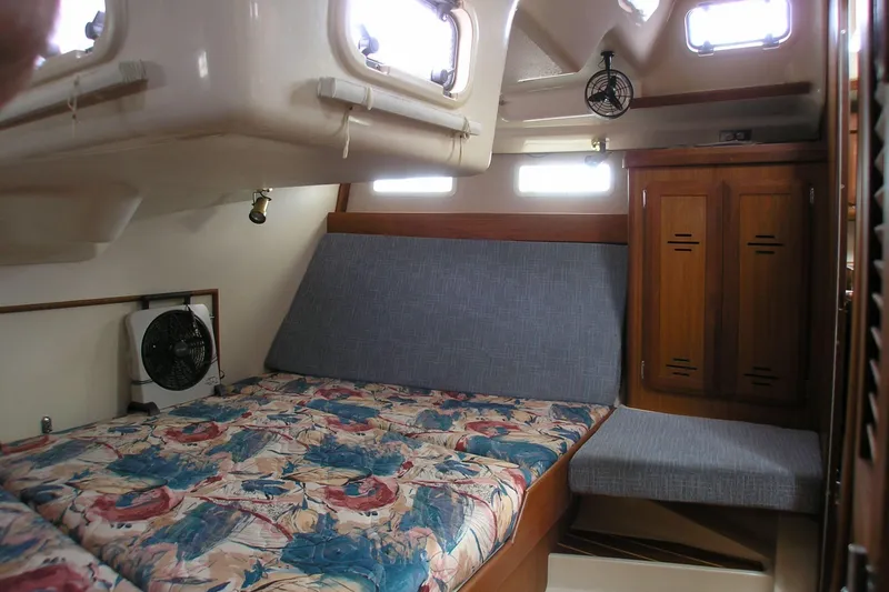 Slide: The Image of Interior cabin of 1996 Hunter 37.5 Legend sailboat with bed and wooden cabinetry. - 9