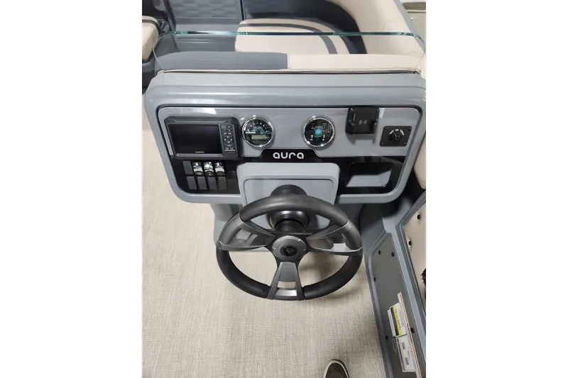 Slide: The Image of 2026 Avalon Aura Quad Lounge dashboard with steering wheel and control panel. - 12