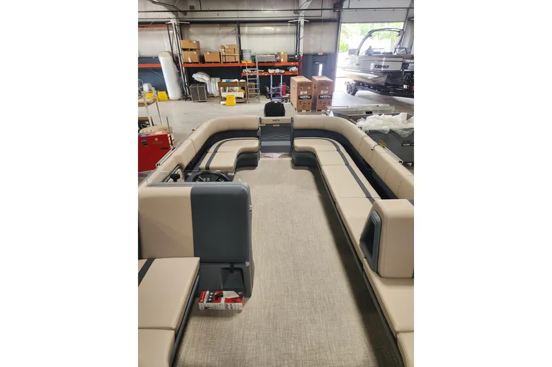 Slide: The Image of 2026 Avalon Aura Quad Lounge interior with spacious seating in a workshop setting. - 7