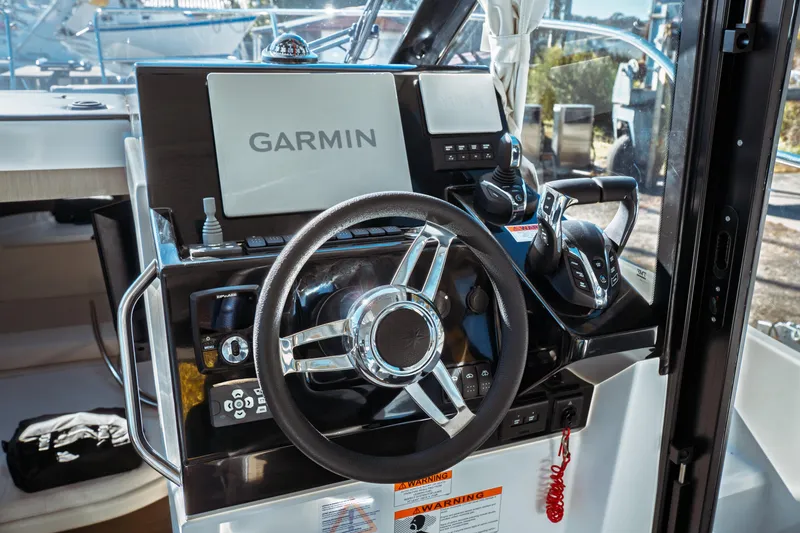 Slide: The Image of 2024 Jeanneau NC 895 Series 2 boat bathroom interior with compact design and window. - 24