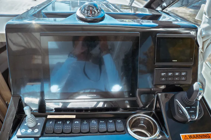 Slide: The Image of 2024 Jeanneau NC 895 Series 2 boat bathroom with modern toilet and window. - 25