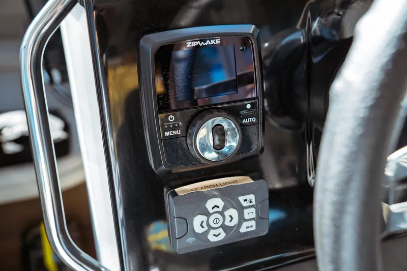 Slide: The Image of 2024 Jeanneau NC 895 Series 2 cabin interior with round bed and windows. - 28