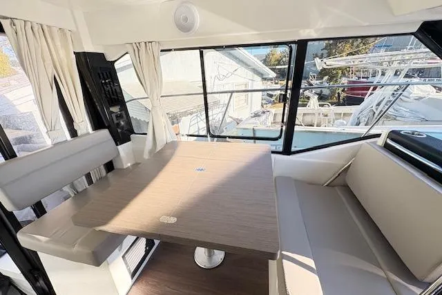 Slide: The Image of 2024 Jeanneau NC 895 Series 2 boat docked at marina, front view. - 3