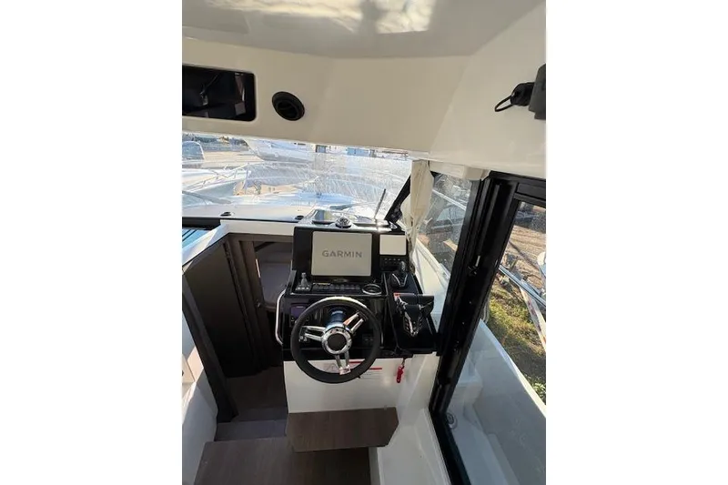 Slide: The Image of 2024 Jeanneau NC 895 Series 2 boat docked with twin Yamaha outboard engines. - 4